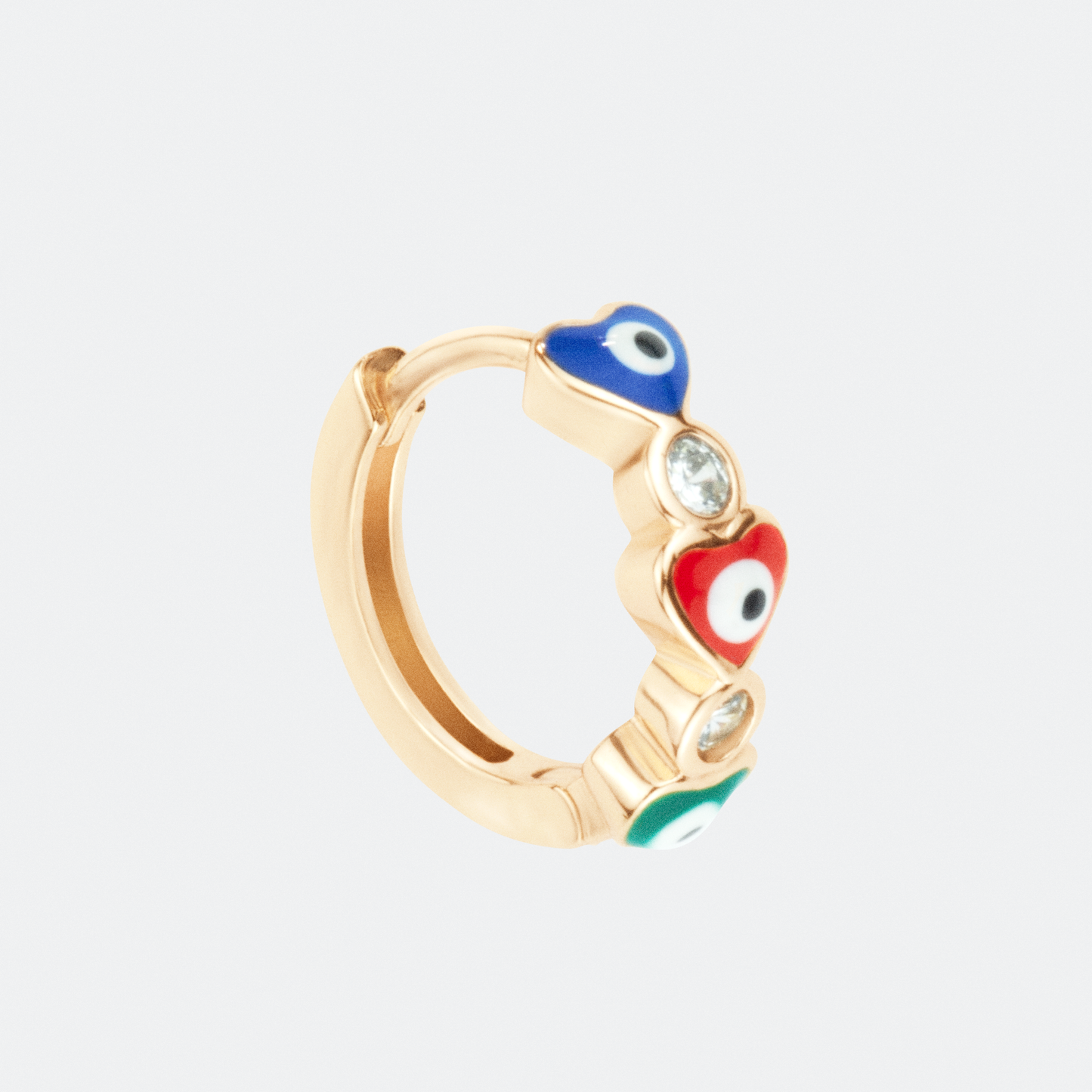 The Amor hoop earring by Ocarina, an 18K gold-plated design featuring colorful enamel heart-shaped evil eyes and sparkling zircon stones. A playful and symbolic jewelry piece for protection and love, displayed against a clean white background.