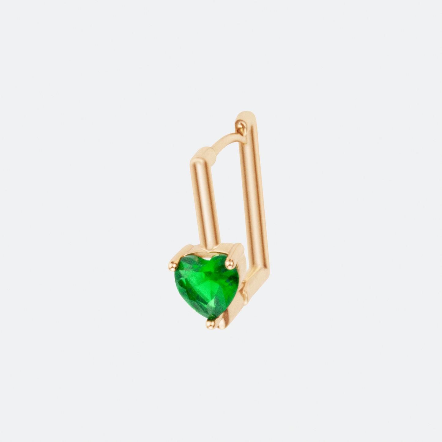 The Viridis hoop earring by Ocarina, an 18K gold-plated geometric square design featuring a striking prong-set green gemstone. A modern and bold jewelry piece combining structure and elegance, displayed against a clean white background.