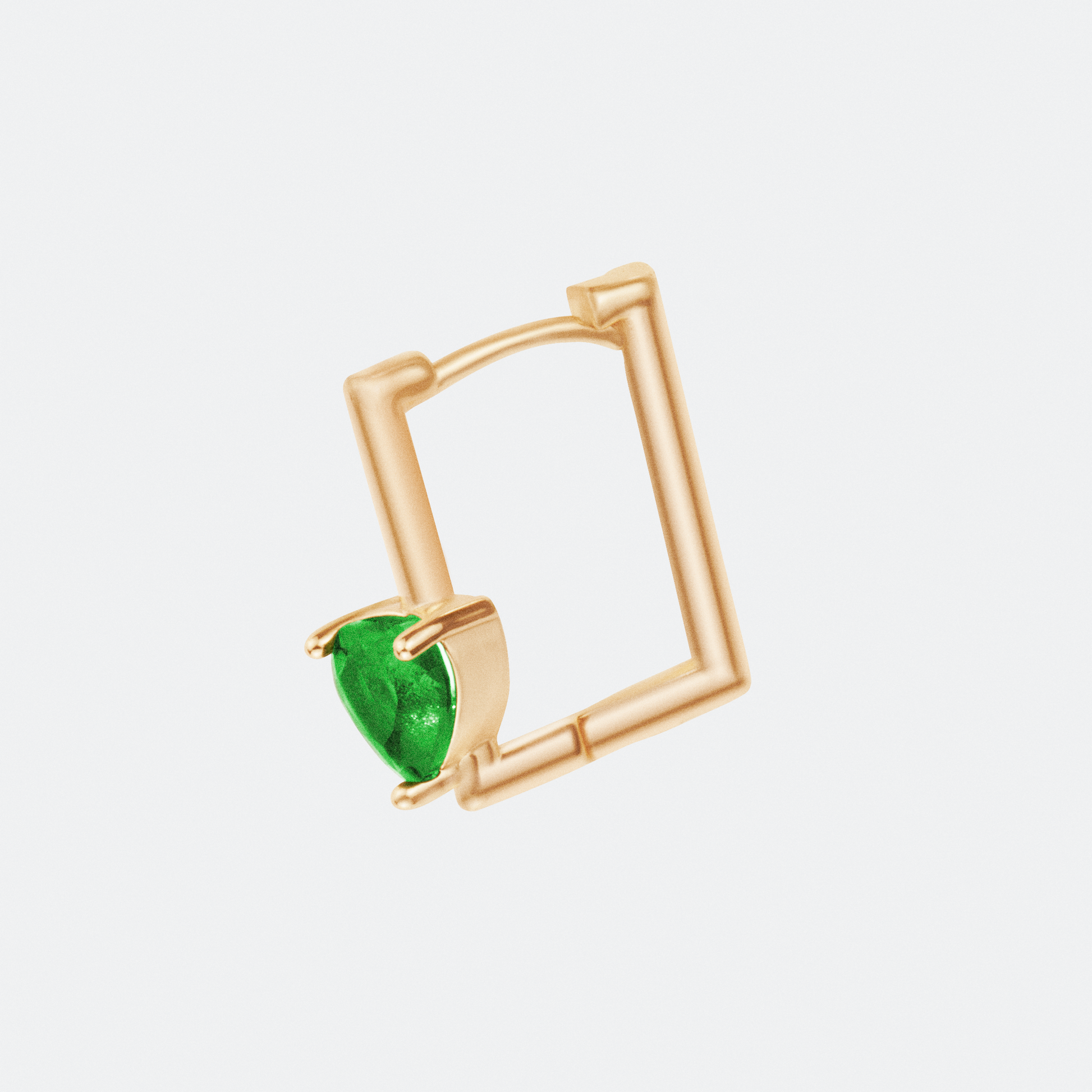 The Viridis hoop earring by Ocarina, an 18K gold-plated geometric square design featuring a striking prong-set green gemstone. A modern and bold jewelry piece combining structure and elegance, displayed against a clean white background.